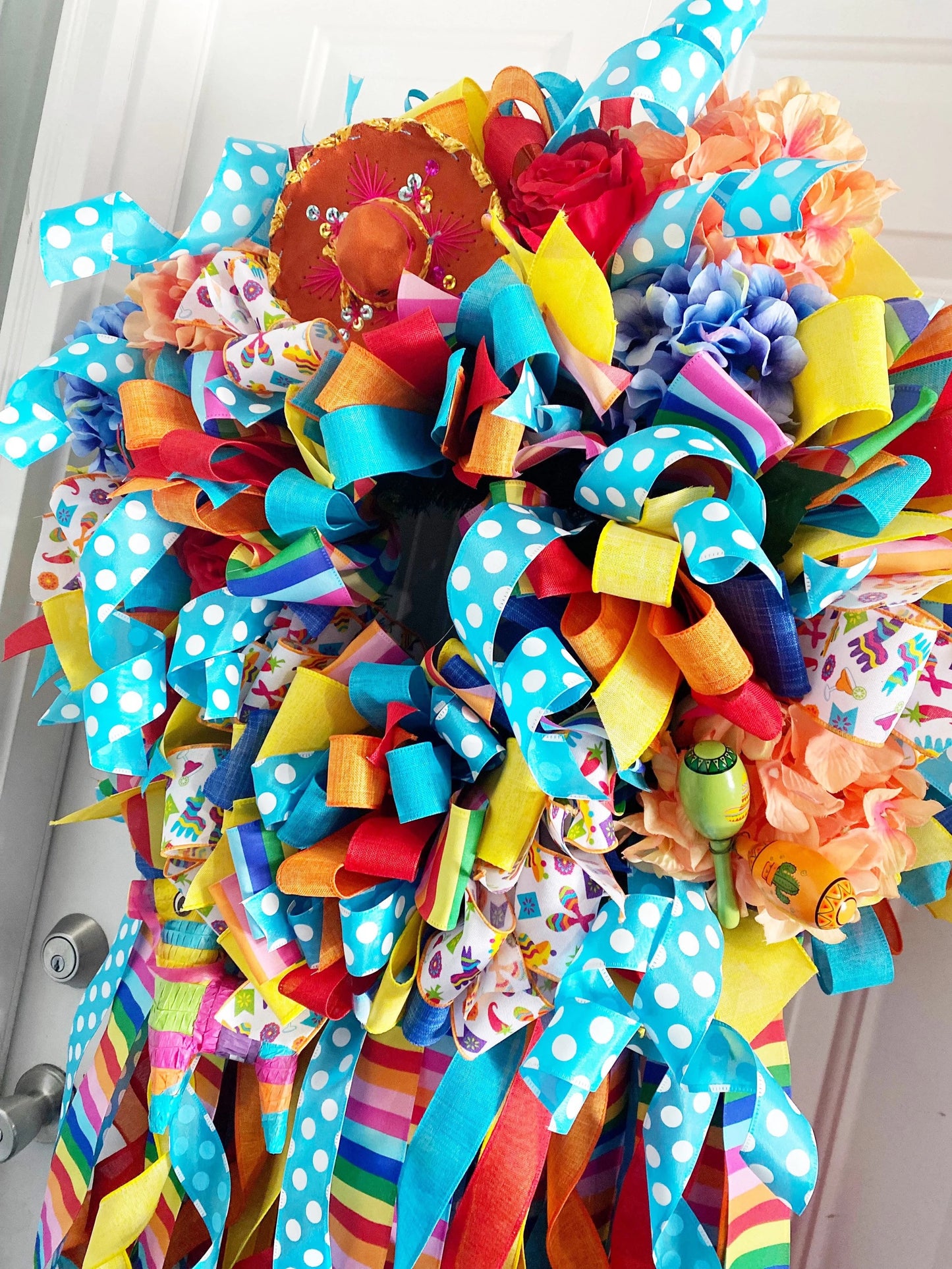 Cinco De Mayo Wreath in Blue Yellow, Orange, and Multicolors Featuring Maracas & Piñatas.