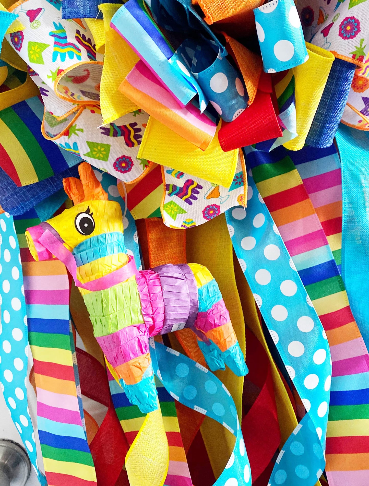 Cinco De Mayo Wreath in Blue Yellow, Orange, and Multicolors Featuring Maracas & Piñatas.