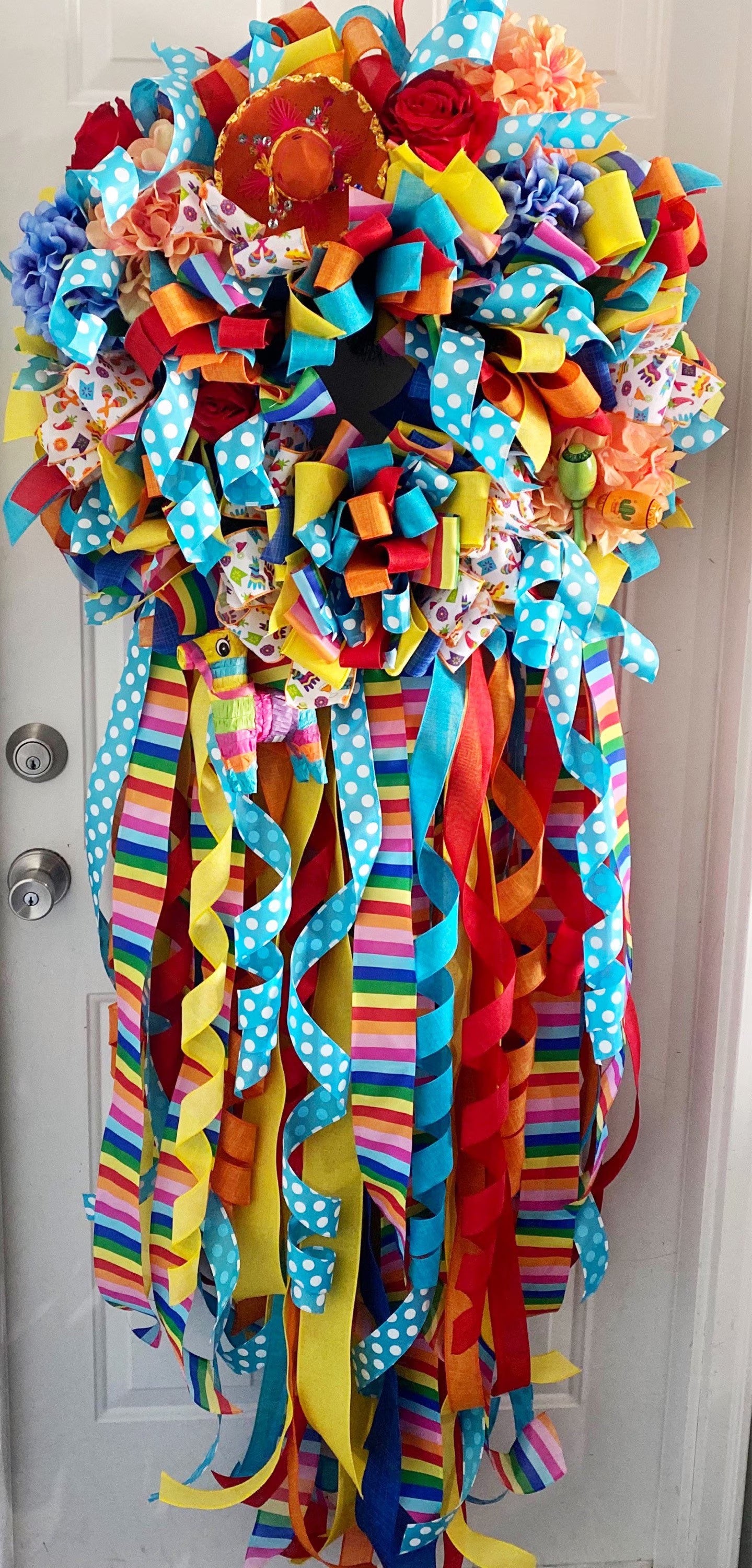 Cinco De Mayo Wreath in Blue Yellow, Orange, and Multicolors Featuring Maracas & Piñatas.