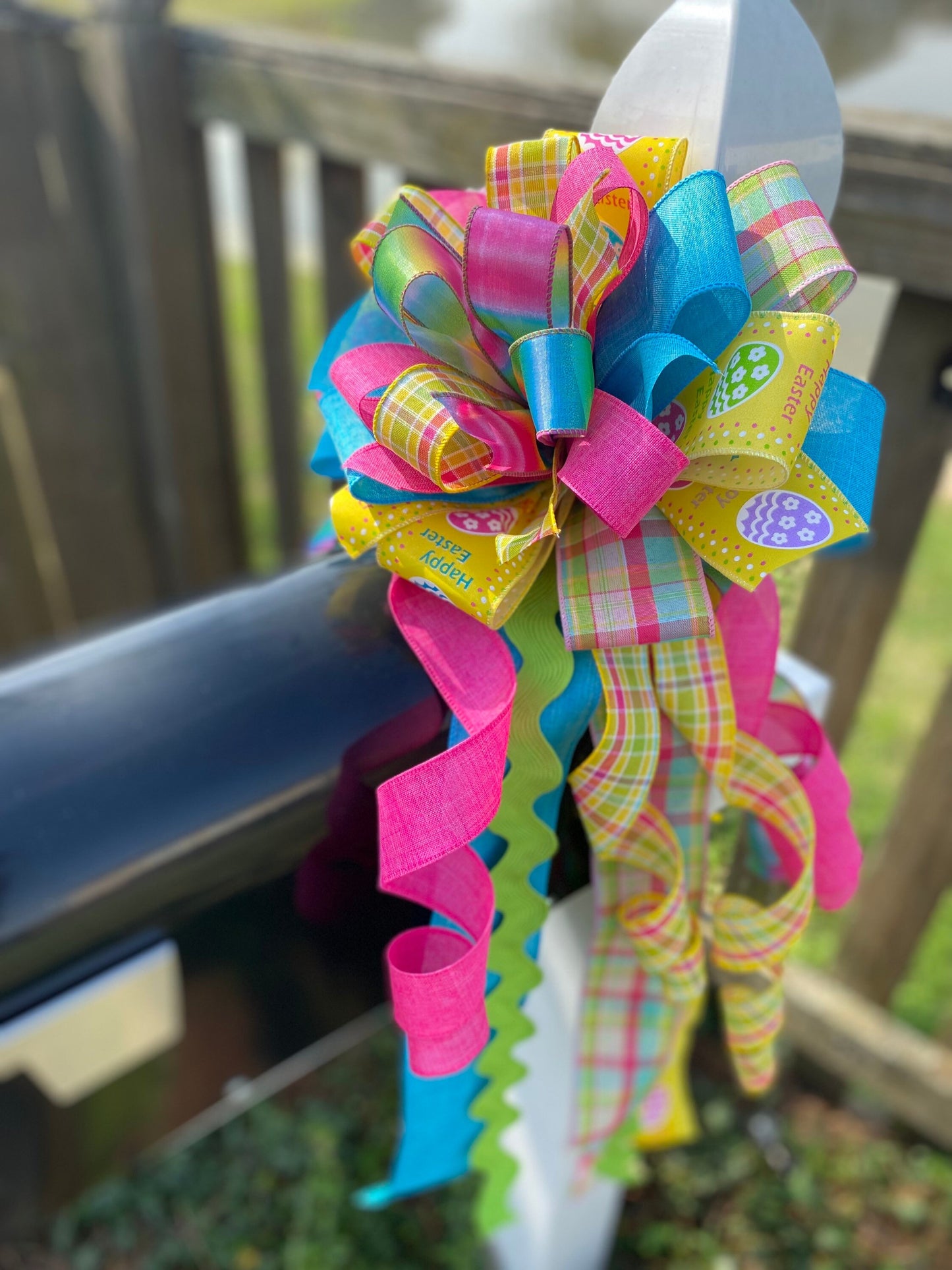 Easter Bow in Teal, Yellow, and Pink Multipattern Featuring Easter Eggs. Perfect for Mailbox, Door, and Wreath.