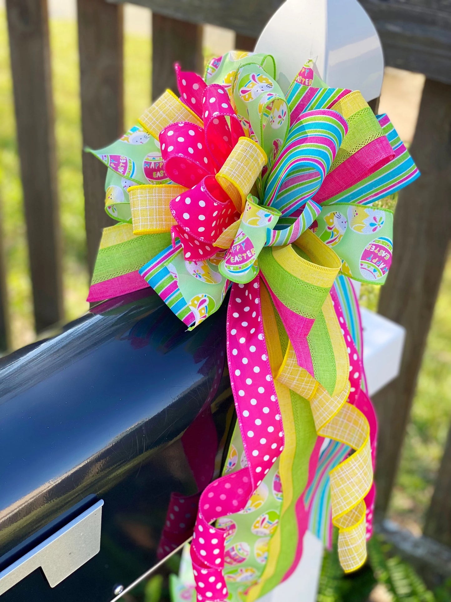 Easter Bow in Yellow, Pink, & Green with Multi Pattern Ribbon Featuring Easter Eggs and Bunnies. Perfect for Mailbox, Door, and Wreath.