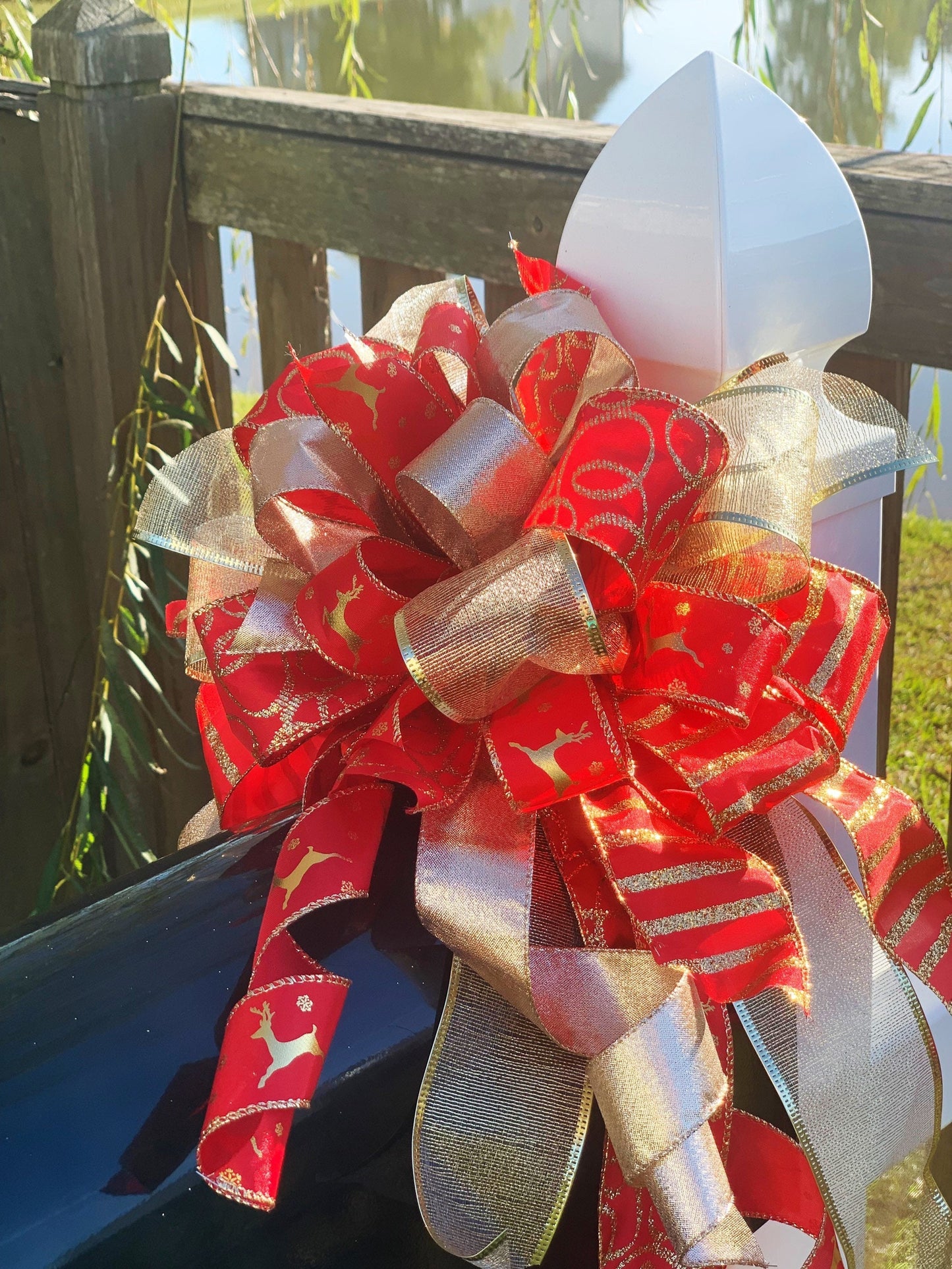Christmas Bow in Red and Gold Featuring Gold Reindeer Ribbon. Perfect for Mailbox, Door, or Wreath.