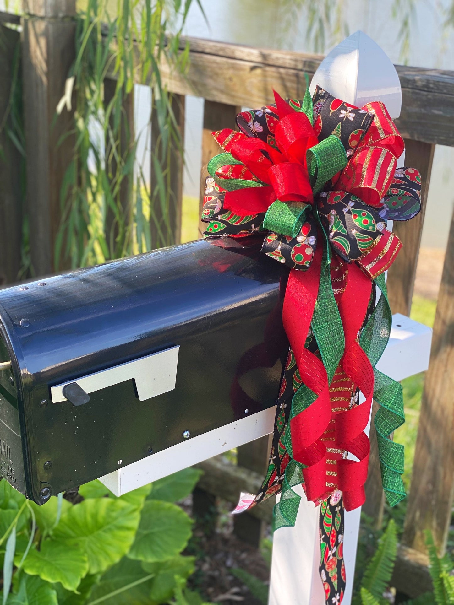 Christmas Bow in Red, Black, and Green Featuring Colorful Ornament Ribbon. Perfect for Mailbox, Door, and Wreath.