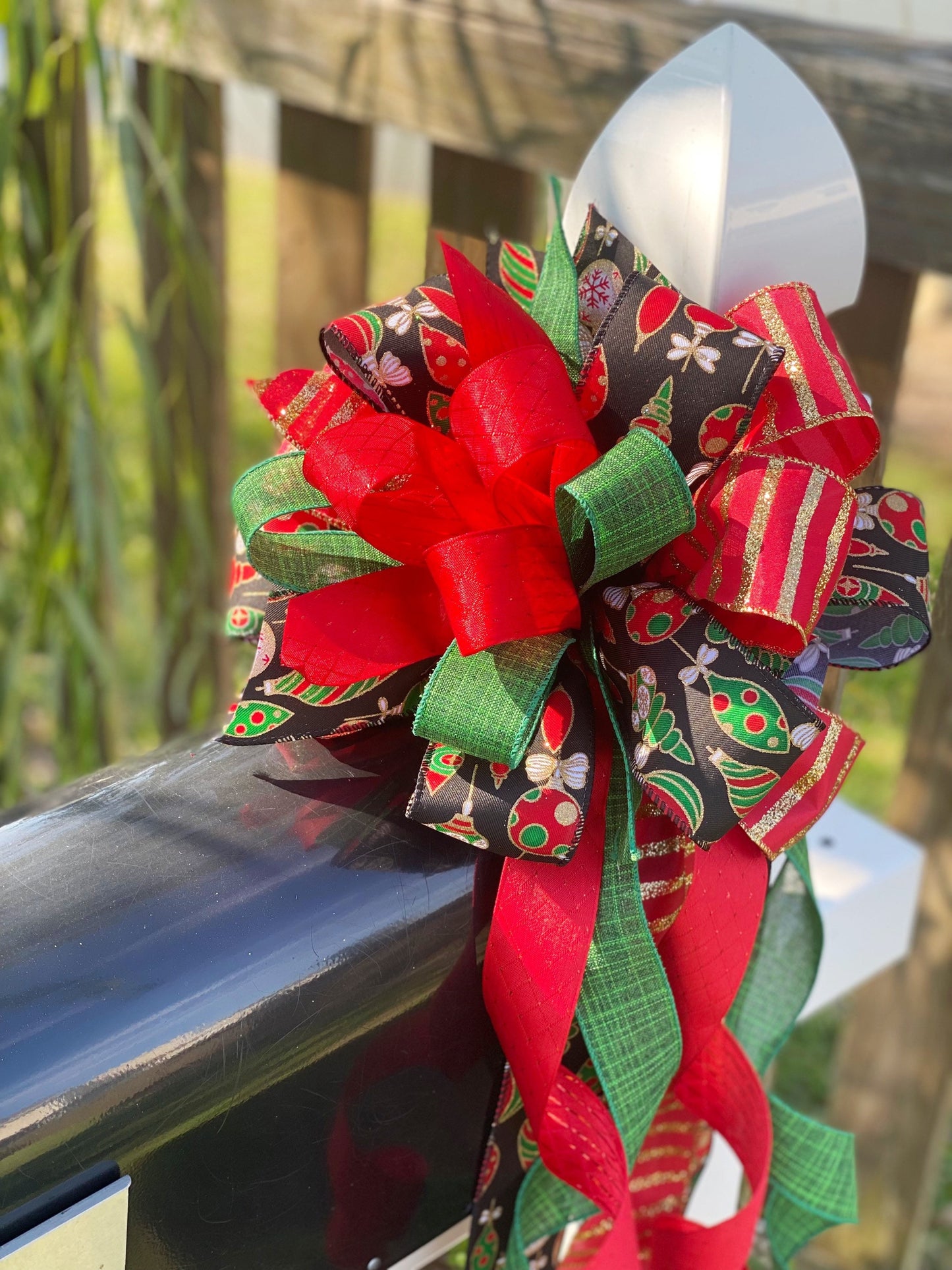 Christmas Bow in Red, Black, and Green Featuring Colorful Ornament Ribbon. Perfect for Mailbox, Door, and Wreath.