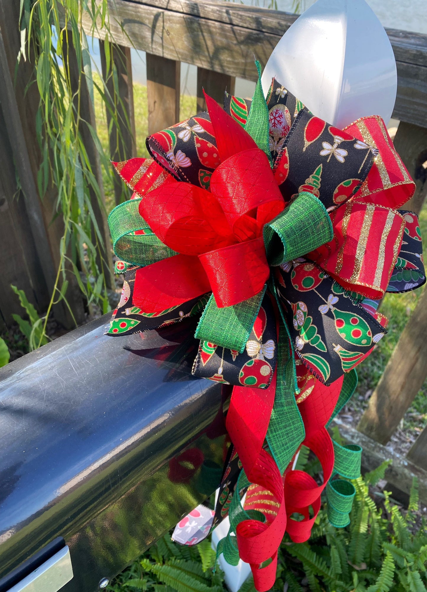 Christmas Bow in Red, Black, and Green Featuring Colorful Ornament Ribbon. Perfect for Mailbox, Door, and Wreath.